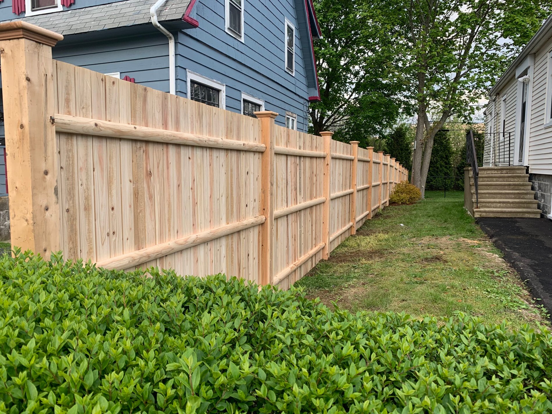 Cedar privacy fence built along the side of a home by Prime Fence